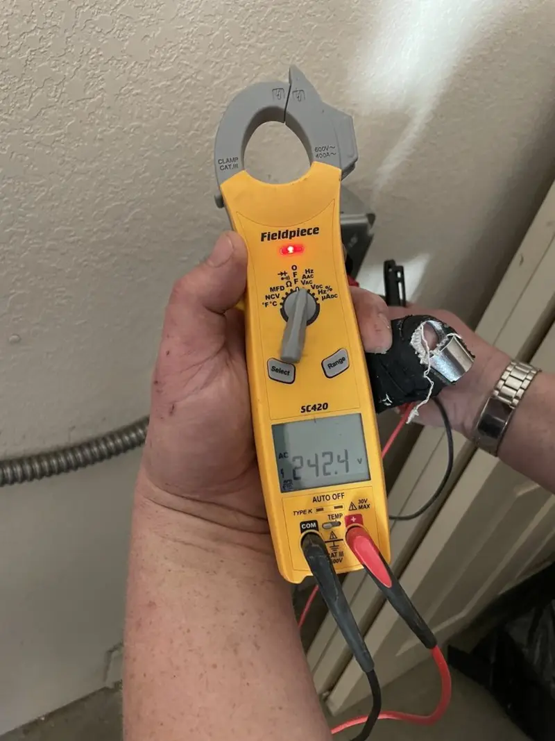 Voltage testing with clamp meter during Recessed Lighting Installation in Colden